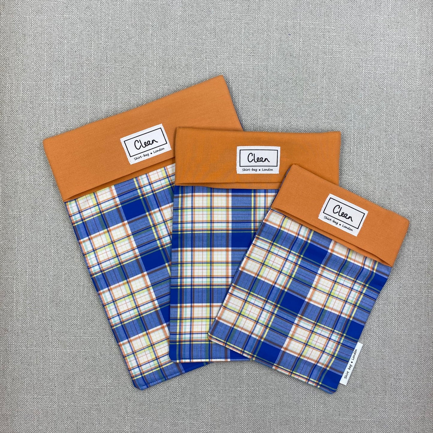 Blue, yellow & orange check on white with orange top