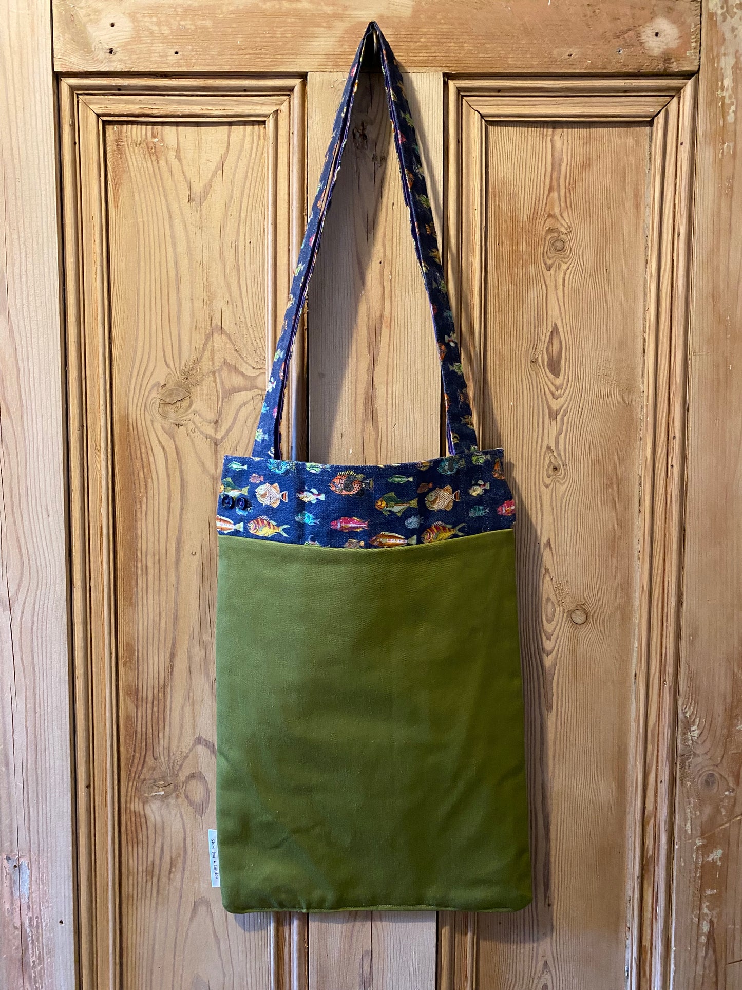 Fish on navy cuff with green