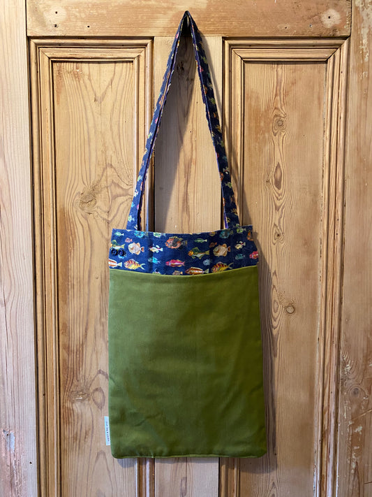 Fish on navy cuff with green