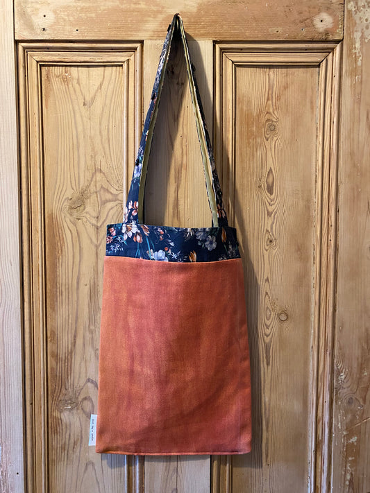 Flowers on navy cuff with orange