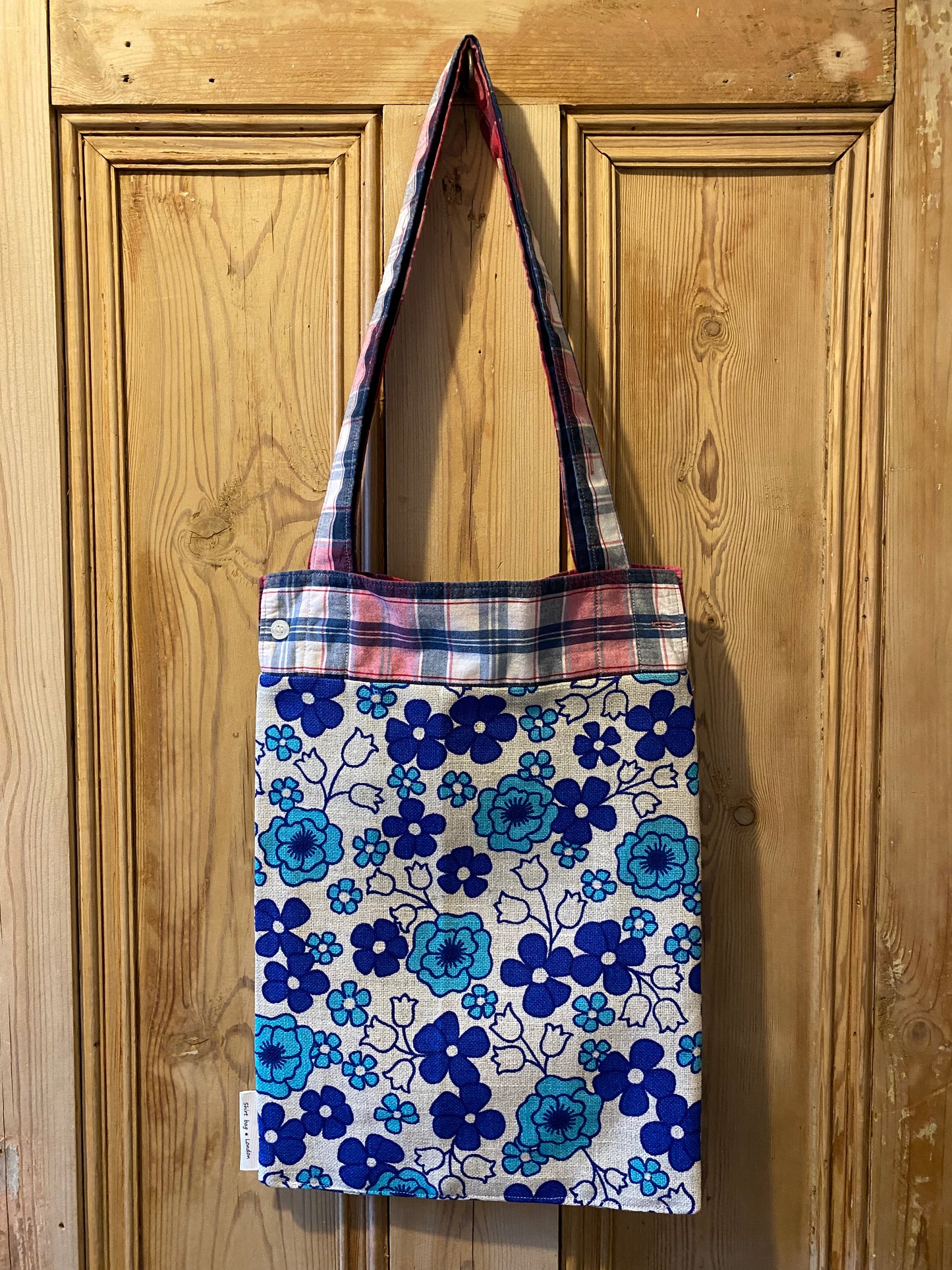 Navy, pink & white tartan with blue flowers on beige