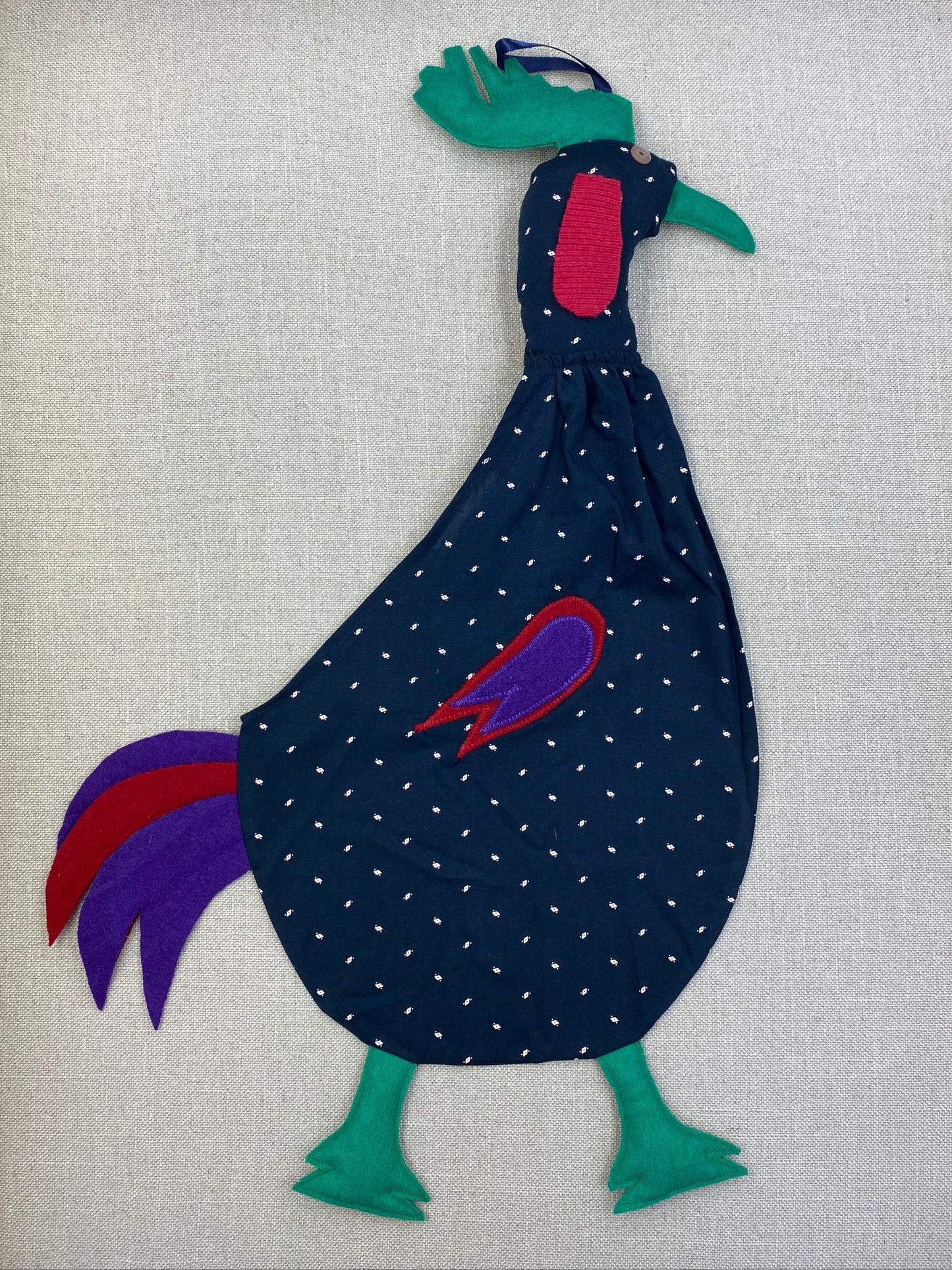 White squiggles on navy with green, red & purple