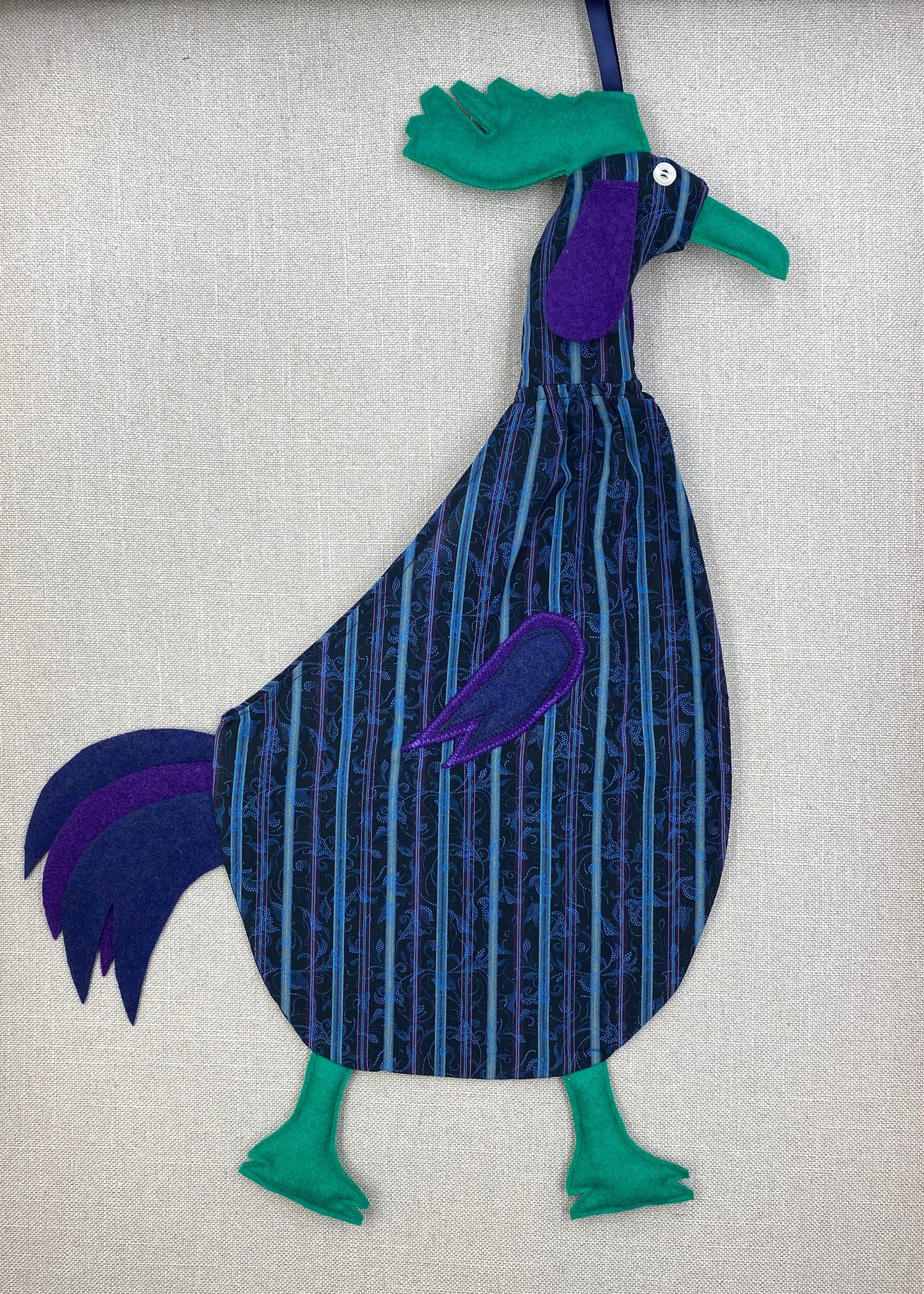 Filigree on blue stripe with green, purple & navy