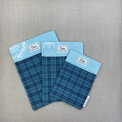 Navy tartan on teal with aqua & white snowflake top