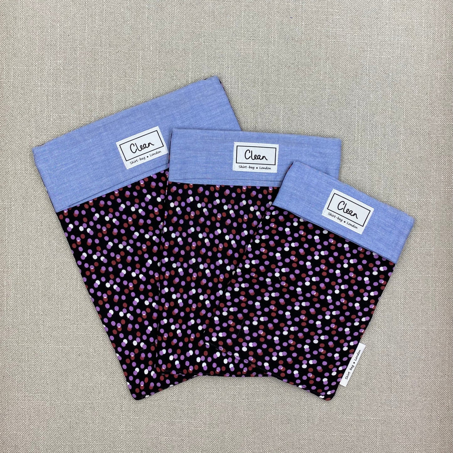 Purple & white spots on black  with blue top